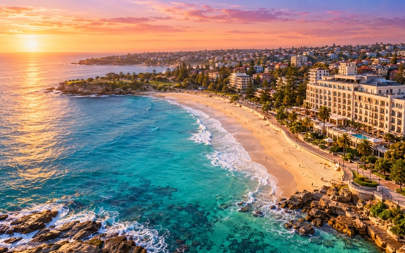 Aspirational Coogee Beach hotel view overlooking turquoise water in golden light