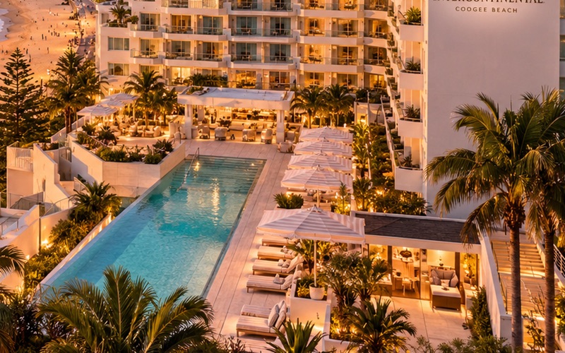 Palm trees and a poolside terrace in the Coogee hotel concept